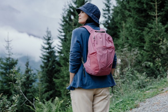 Young woman in sporty, summery hiking clothes with a sporty shoulder&nbsp;bag